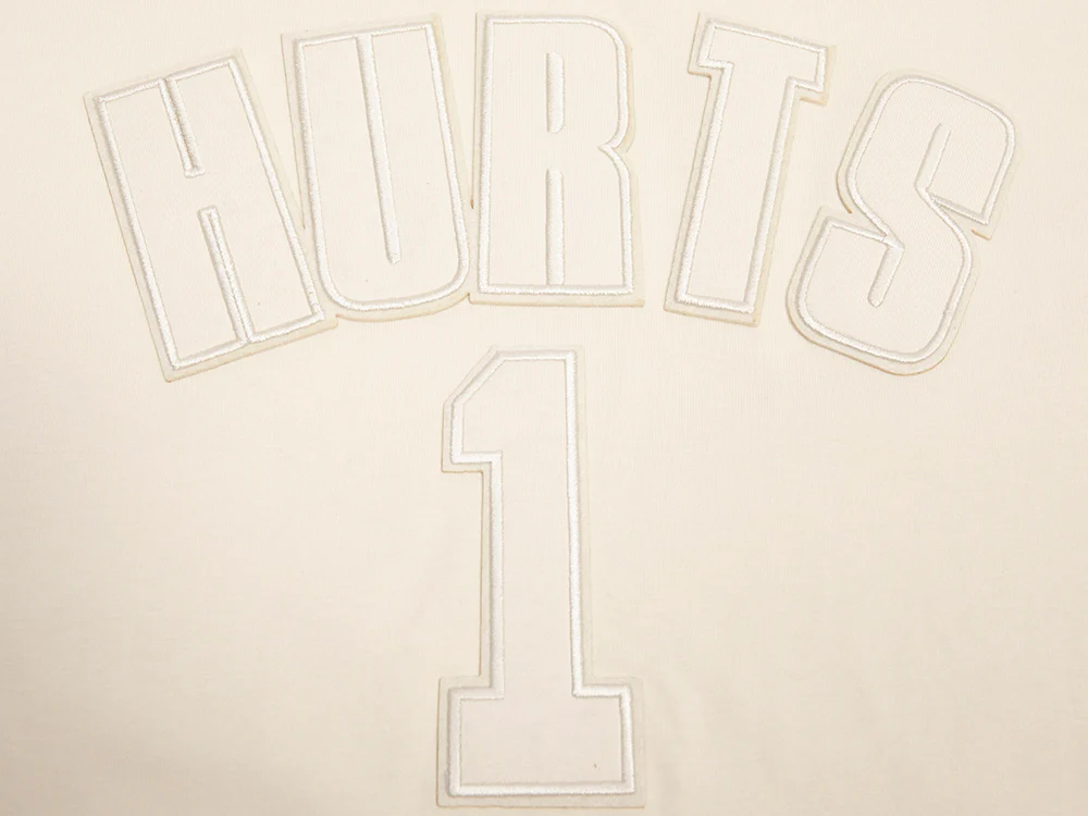 NFL PHILADELPHIA EAGLES JALEN HURTS #1 NEUTRAL MEN'S SHORT SLEEVE PULLOVER HOODIE (EGGSHELL) - Image 5
